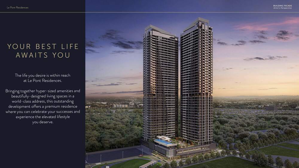Le Pont Residences twin towers in Bridgetowne East at dusk